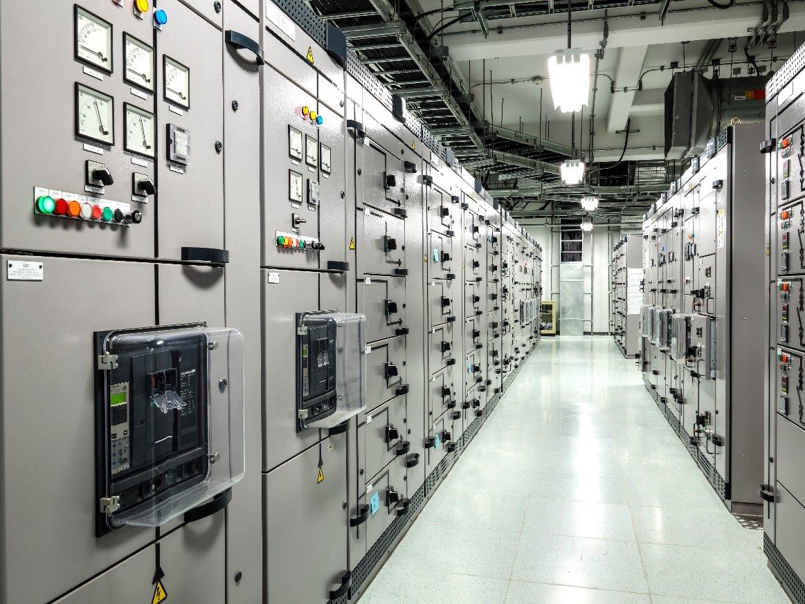 Industrial switchgear lineup with breakers, metering and arc flash warning labels